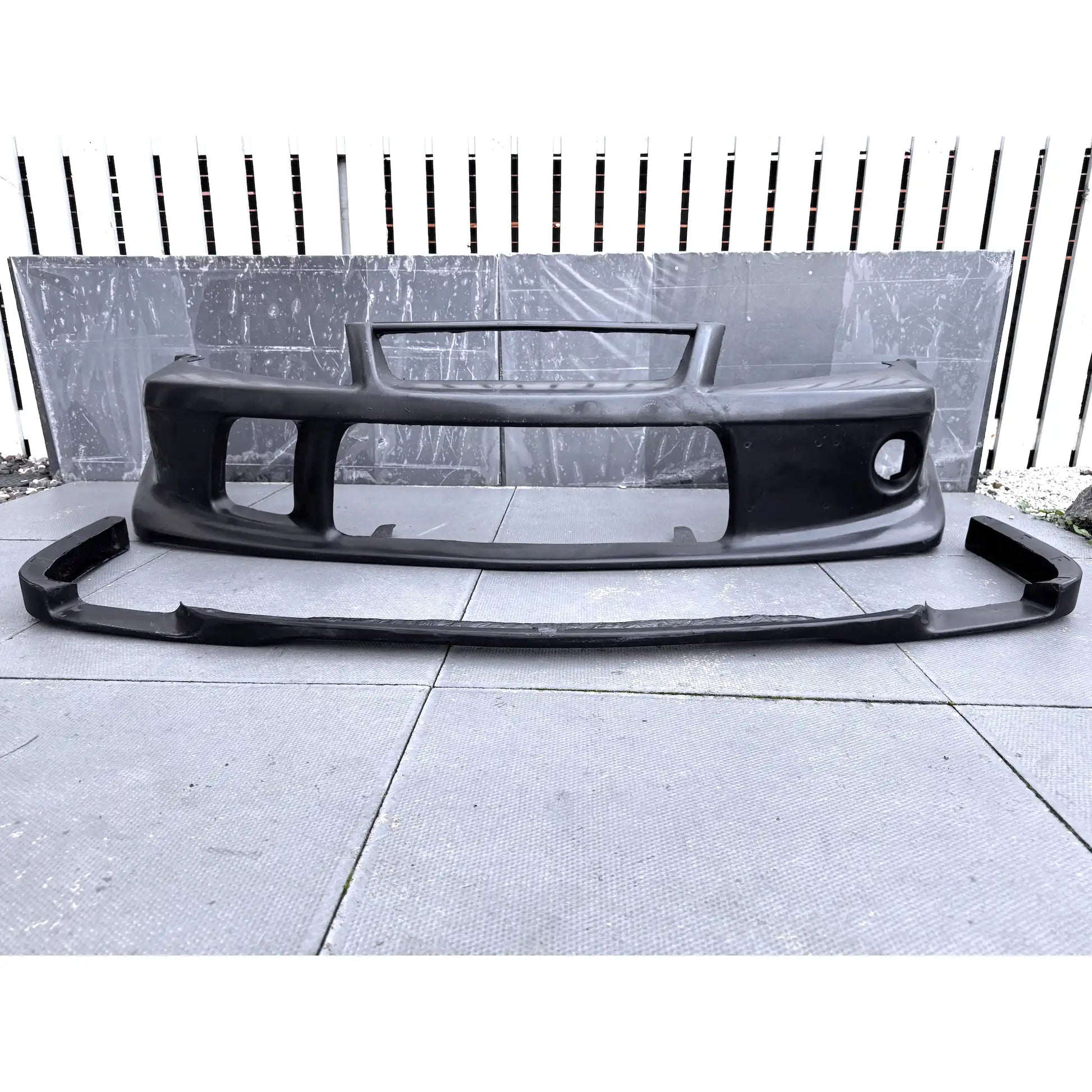 Fibreglass Tommi Makinen Edition front bumper for Mitsubishi Evo 6 Ð lightweight, race-inspired style